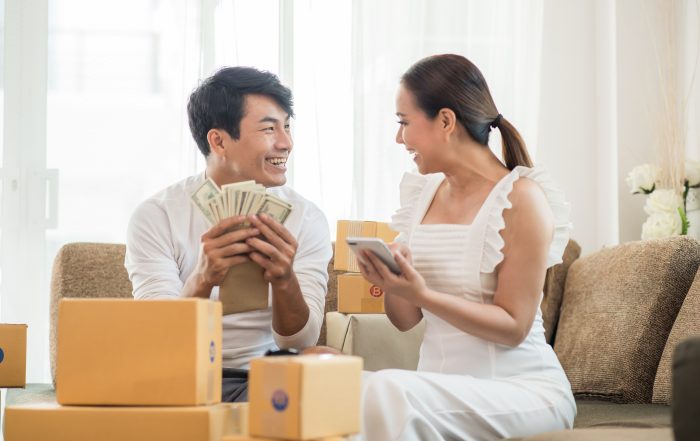 Happy couple at Home office with Online business Marketing onli happy couple with money at home