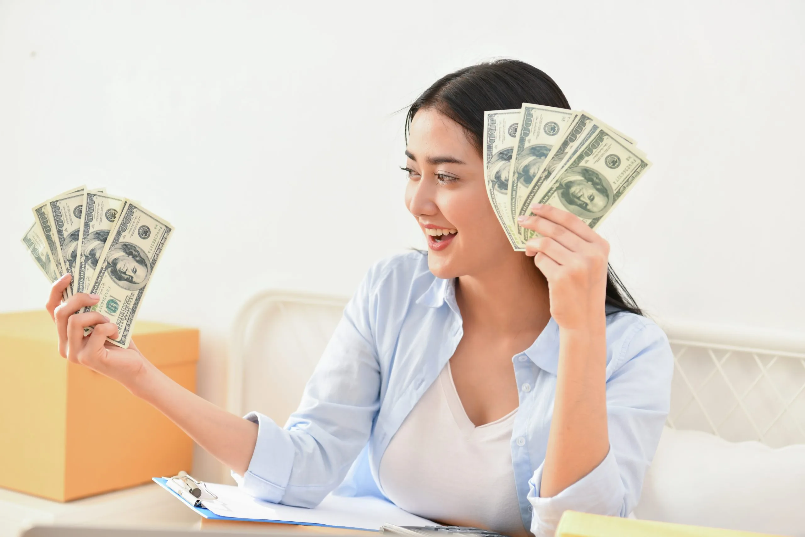 young businesswoman holding money