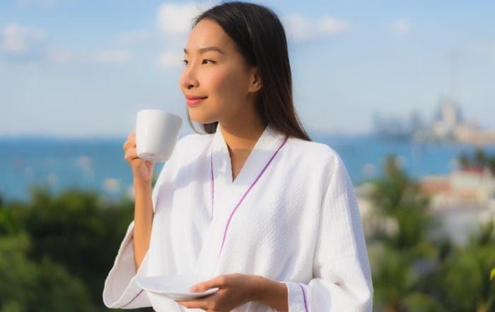 Portrait beautiful young asian women hold coffee cup in hand aro