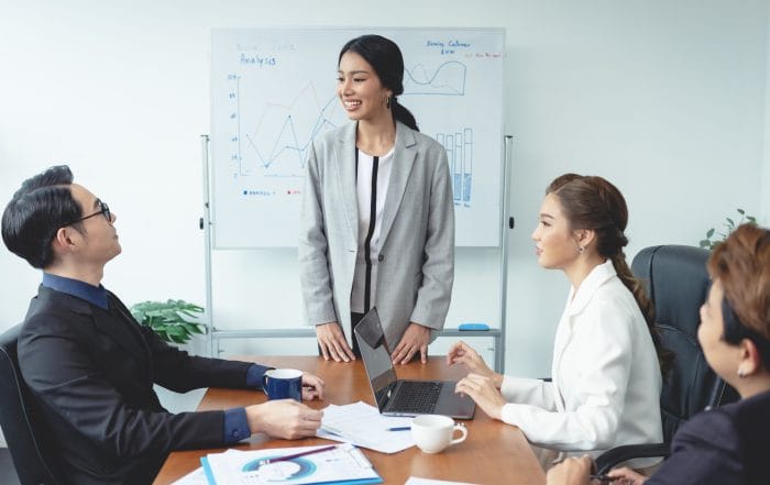 Asian businesswoman presenting of his work to corporate colleagu