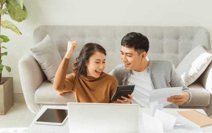 Processing online payment Husband and wife processing online payment while shopping online